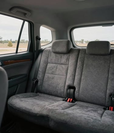 Photography of a clean and sanitized taxi interior with high-quality upholstery, soft cinematic lighting, professional atmosphere, North American / Texan-Mexican border region visible through the window.