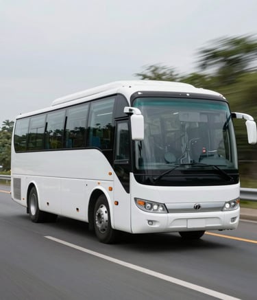 A modern, white charter bus traveling on a wide North American highway with a blurred natural background, emphasizing speed, reliability, and smooth travel. The composition is clean and centered.
