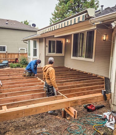 Custom deck framing project behind a home in Lakewood CO