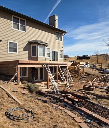 Structural deck framing and beam installation for a residential rebuild by Elk Valley Contractors.