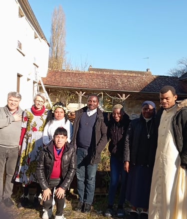 A diverse group of priests and nuns standing together outdoors in a sunny courtyard.