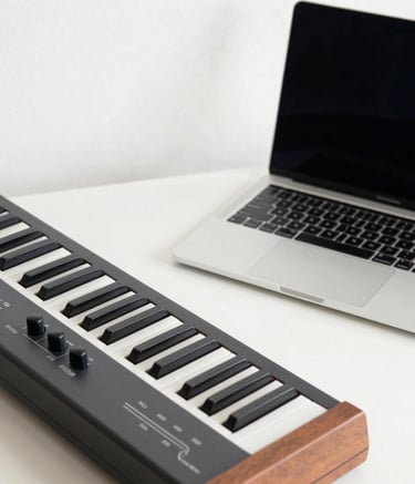 A cozy Scandinavian-style office with light wood furniture. On a clean desk sits a modern MIDI keyboard next to a sleek consumer ethernet switch. The room is flooded with soft morning light, and a wall in the background is painted in a muted Nordic grey blue.