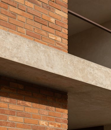 Close-up architectural shot of a modern residential project in Argentina. Focus on the intersection of a terracotta-colored brick wall and a clean beige concrete beam. The composition is minimalist and abstract, highlighting high-quality textures and precise construction under warm South American daylight.