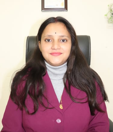 a woman in a purple jacket and a white shirt