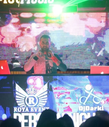 a man standing in front of a large screen with a microphone