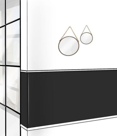 Couloir contournant une chambre, décoré en blanc et noir. comportant une verrière atelier