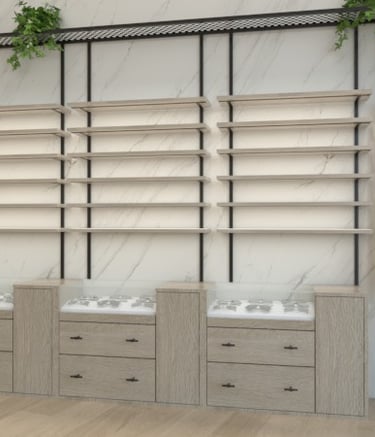 Diseño de interiores para ópticas, mueble expositor con estantes y vegetación decorativa.