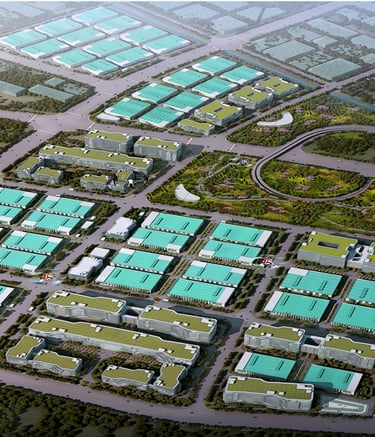 Aerial view of a sustainable industrial park with green roofs and modern commercial buildings.
