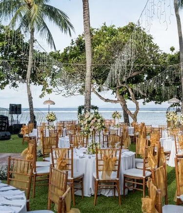 Beach wedding decoration with white drapes and tropical flowers by Pune wedding planning experts