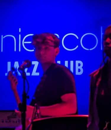 An image of Jamie Walker playing Electric Bass at Ronnie Scott's Jazz Club in London