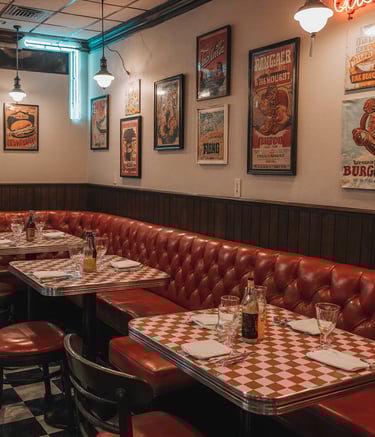 a restaurant with a checkered table and chairs