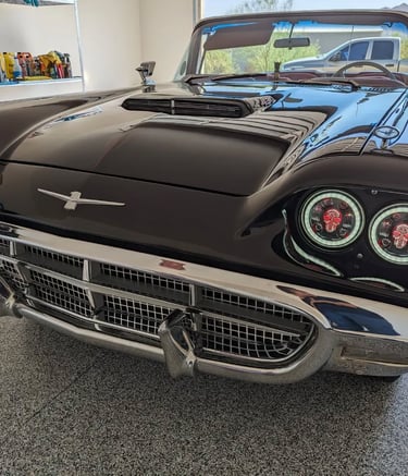 A customized Ford Thunderbird with modified lights for stylizing.