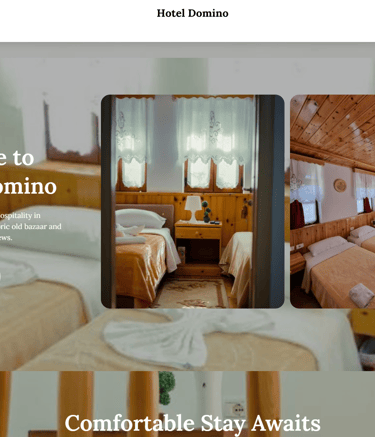 a hotel room with a bed and two beds