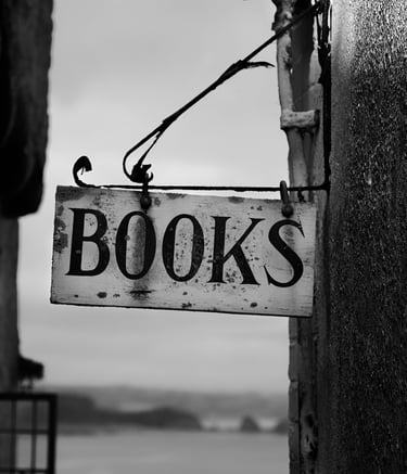 a sign that says books on it on the side of a building