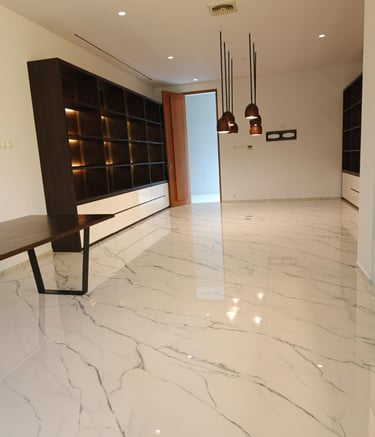 a room with a table and a bench in the middle of the room