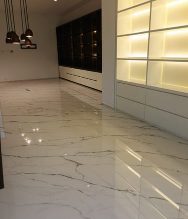 a room with a marble floor and a white marble floor