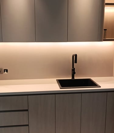a kitchen with a sink and a refrigerator