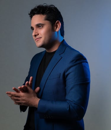 a man in a blue suit and black shirt