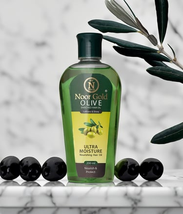 Product photography of green olive oil bottle with olives and marble background