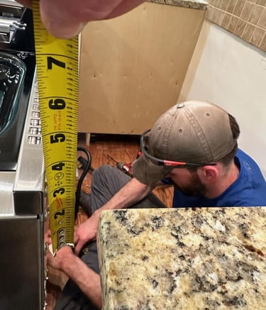 shows install of an electric range by our installer in progress