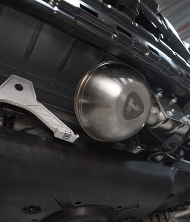 an Enlab Mercedes engine with a chromed headlight on it