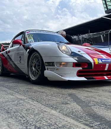 an Enlab Porsche sports car with a red and white stripe on it