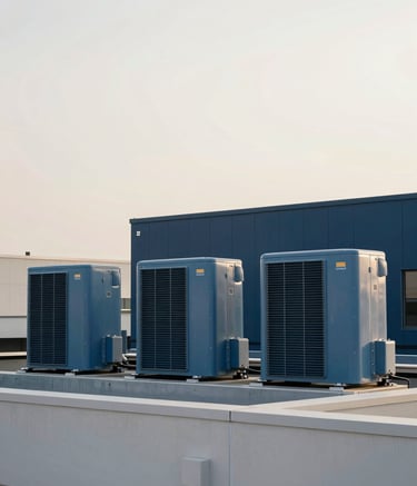 A wide-angle photography shot of a commercial rooftop HVAC system on a modern North American / US building. The sky is a soft off-white, and the equipment has clean lines in steel blue and dark navy tones. The composition is symmetrical and clean, representing modern efficiency.