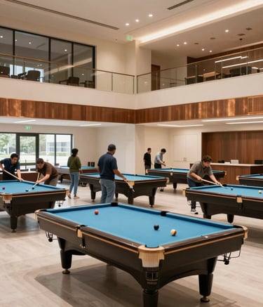 A wide-angle interior photograph of a modern, sophisticated community hall in Alpharetta, Georgia. Diverse community members are seen engaging in friendly billiards matches in a bright, inviting space with soft cream walls and warm bronze accents.