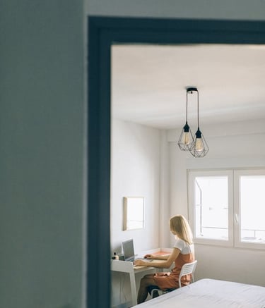 Photo by Nataliya Vaitkevich: https://www.pexels.com/photo/a-woman-sitting-on-a-chair-while-working-