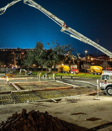 drone image of a crew pouring a concrete foundation