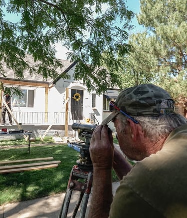 A videographer films a custom home remodeling project by Dennis Brewer Construction in Denver.