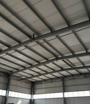 Detailed view of hooks and washers used in roofing applications on a marsala-colored background.