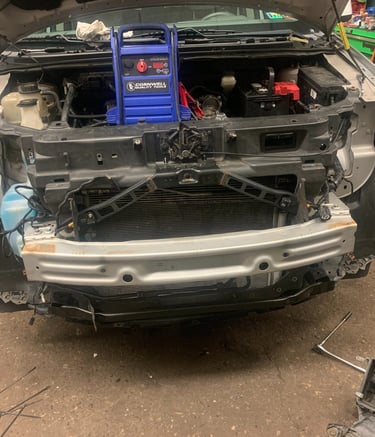 Suv Had bumper removed for headlight services. Battery is being charged