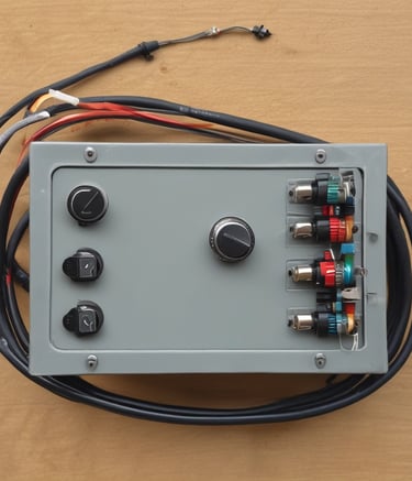 Wide shot of multiple control boxes lined up ready for shipment.