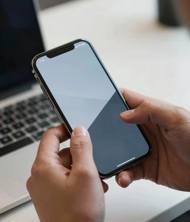 A high-detail close-up of a person's hands in a sleek North American office, interacting with a high-end smartphone that displays a sophisticated user interface with light blue and charcoal color schemes.