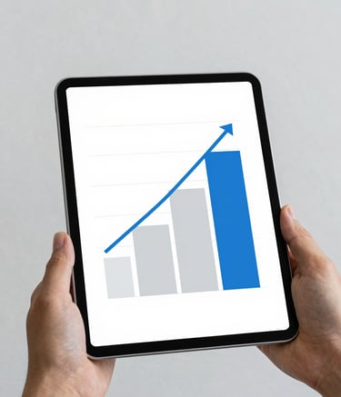 A minimalist and clean composition showing a close-up of a person's hands holding a digital tablet displaying growth charts. The aesthetic is modern and professional, utilizing a color palette of white, light blue (#6C9DD1), and grey (#DFE6EB) to convey security and financial planning.