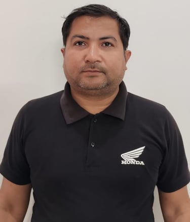 a man in a suit and pink shirt