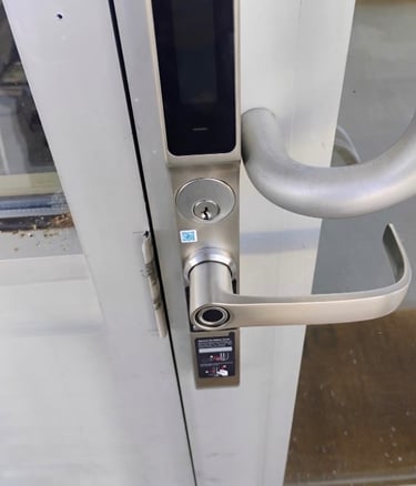 Biometric keypad smart lock installed on commercial building entrance Asheville 