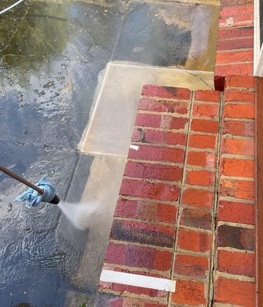 Outdoor tile cleaning using high pressure water blaster