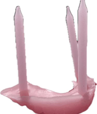 wax sculpture of teeth and birthday candles