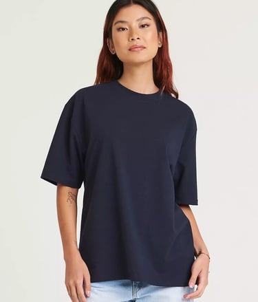 a woman wearing a navt tee - shirt and jeans