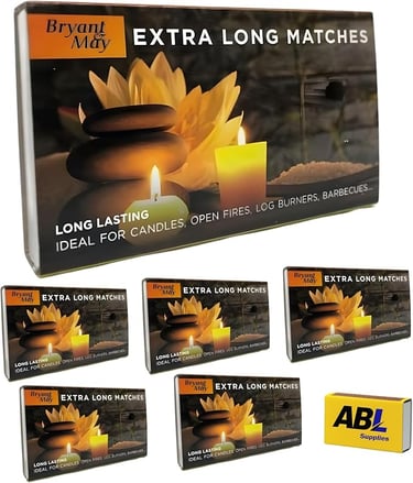 a box of extra long lasting candles with a candle