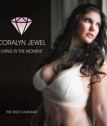 Coralyn on cover of her 2022 calendar wearing white lingerie