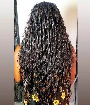 a woman with curly goddess braids