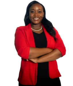 an african american woman in a red jacket and black pants arms folded and smiling