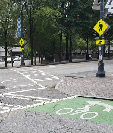 Two-stage bicycle turn queue box with crosswalk and RRFB
