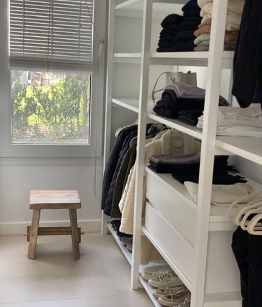a closet with a bench and a bench in the corner