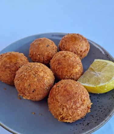 a plate of food with a lemon wedged in it