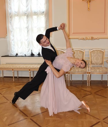a man and woman dancing in a room