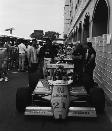 a race car parked in the paddock